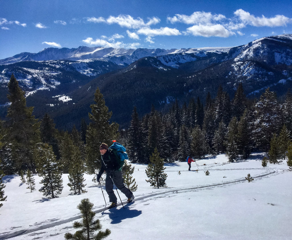 scaled With the morning's high pass (Hagerman) in the background, the team gobbles up the miles to Uncle Bud's Hut.