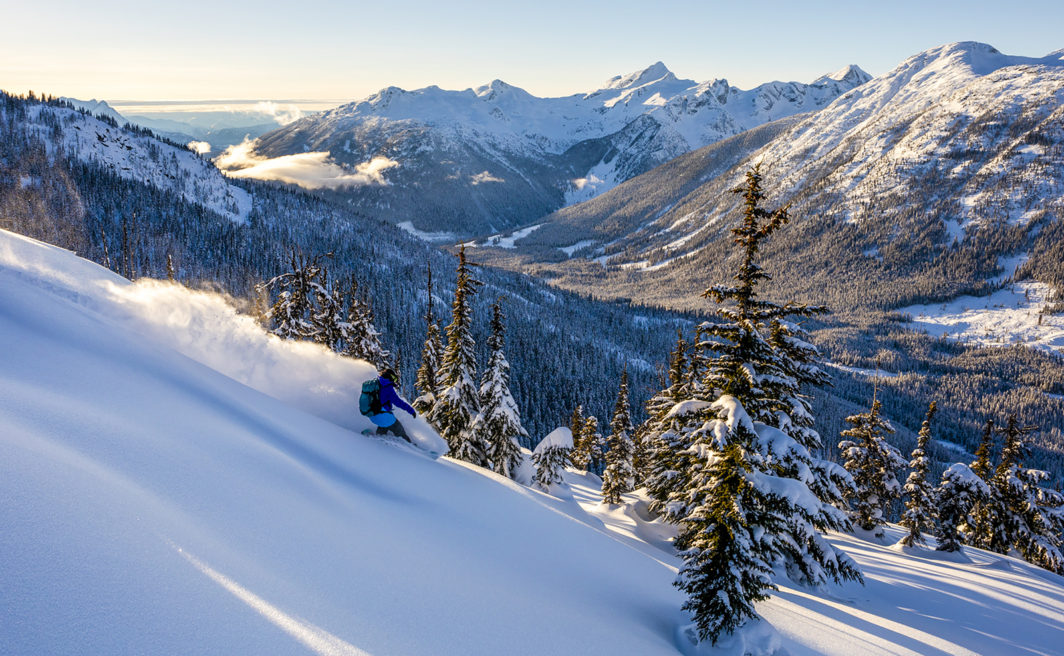 Jen Girardi splitboarding through BC powder. Photo by Ben Girardi.