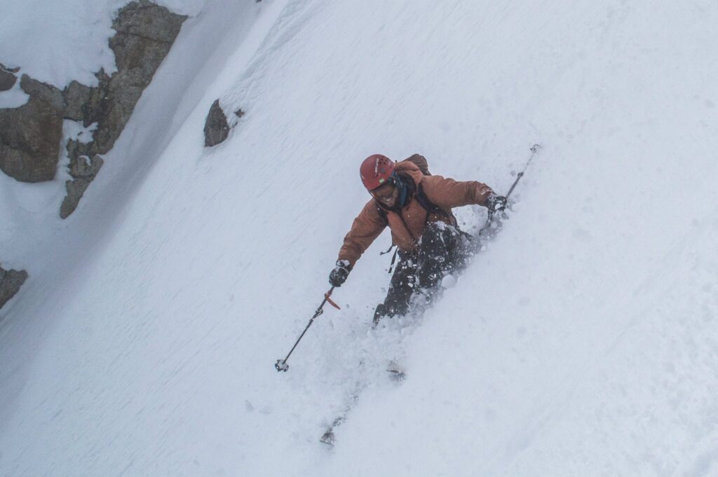 Telemark Ski Mountaineer alpine turn, SW couloir south