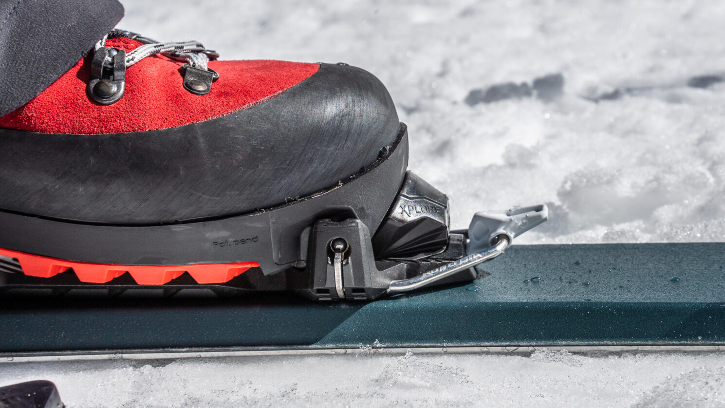 Alpina alaska boot stepping into a Rottefella Xplore binding mounted on Voile Endeavor BC skis