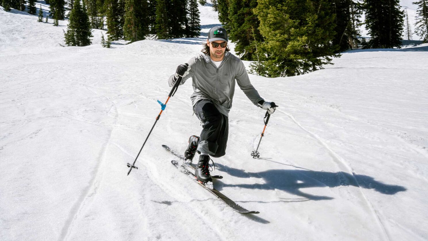 Lightweight XCD gear with scaled skis and Xplore bindings moving through low-angle terrain