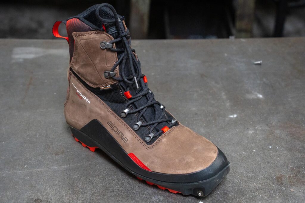 Alpina Pioneer Pro XP boot showing its leather upper, lacing system, and Xplore-compatible sole.