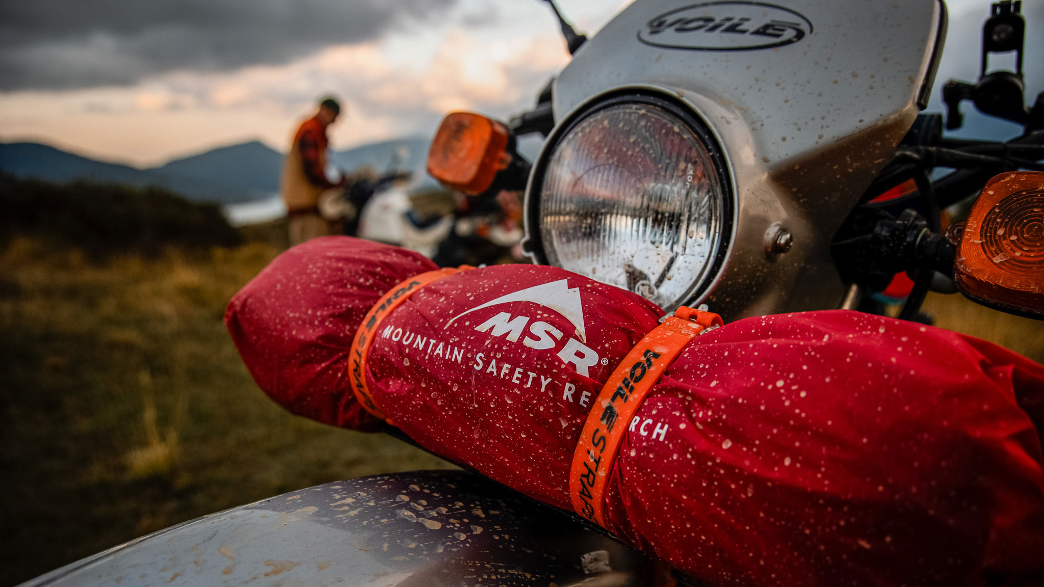 Voile Straps securing MSR tent to a motorcycle fender.