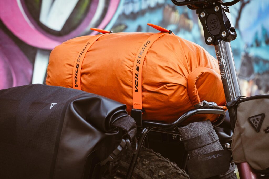 Voile Rack Straps securing a dry bag to a bikepacking rack.