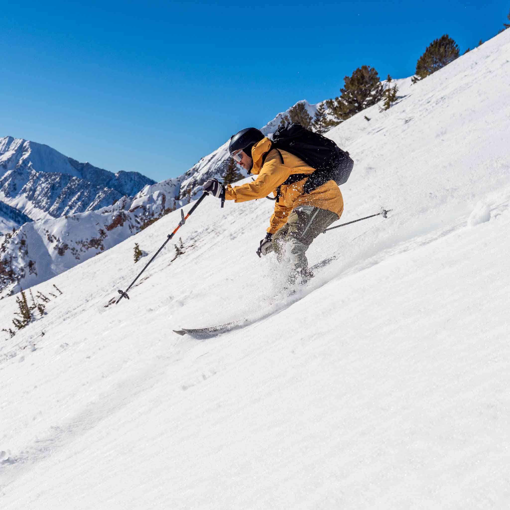Skier on Voile Hyper Manti skis making a turn on a steep snowfield