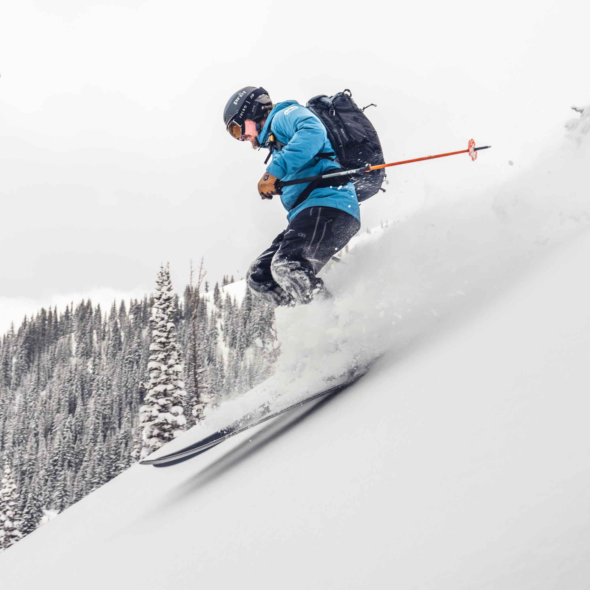 Close up action shot of skier on Voile Manti ACE skis in powder